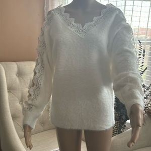 soft and fuzzy sweater with crochet lace detailing front and back, brand new